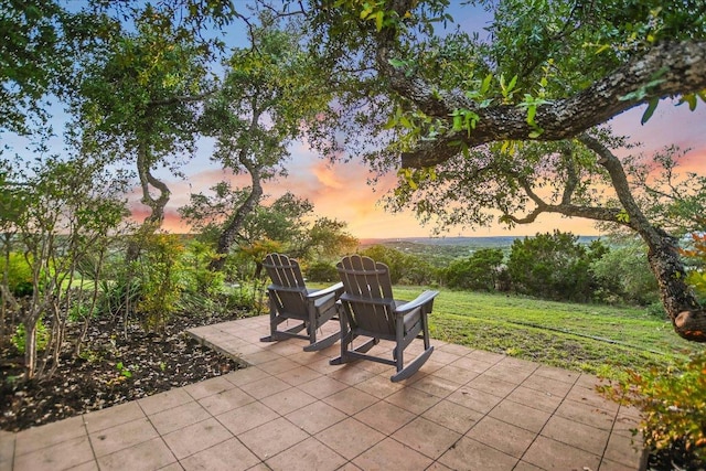 patio terrace at dusk with a yard