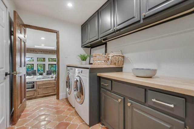 100 Mesa Dr, Wimberley, TX 78676 - laundry room with washing machine and clothes dryer, cabinet space, and recessed lighting