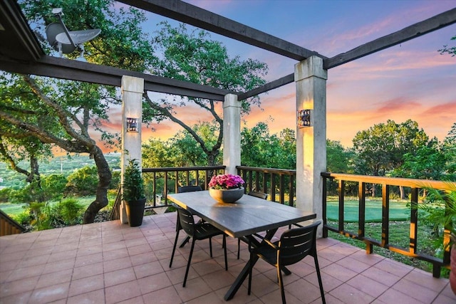100 Mesa Dr, Wimberley, TX 78676 - patio terrace at dusk with outdoor dining space and a patio