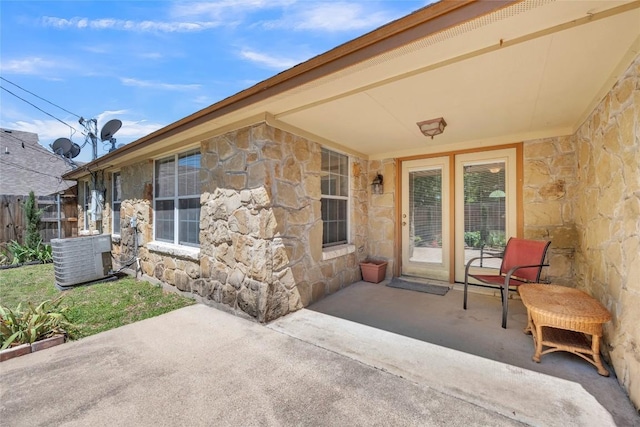 view of patio / terrace featuring fence and cooling unit