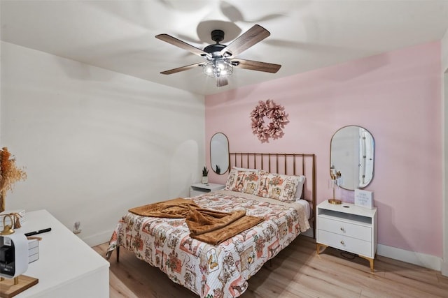 326 W Mulberry St, Fredericksburg, TX 78624 - bedroom with baseboards, a ceiling fan, and wood finished floors