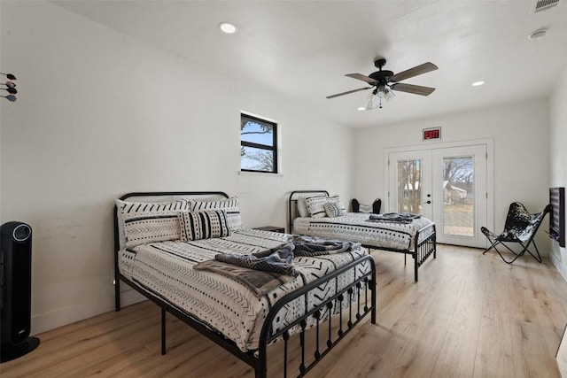 326 W Mulberry St, Fredericksburg, TX 78624 - bedroom featuring light wood-style floors, french doors, baseboards, access to outside, and recessed lighting