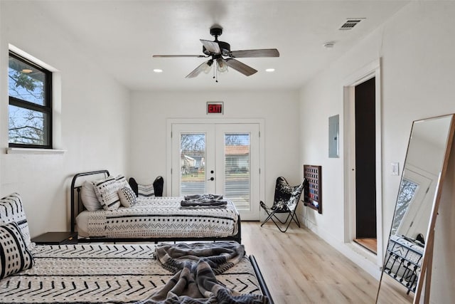 326 W Mulberry St, Fredericksburg, TX 78624 - bedroom with multiple windows, french doors, access to exterior, and light wood finished floors
