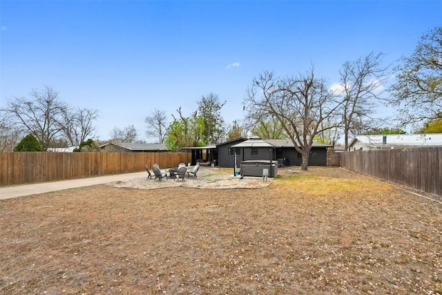 326 W Mulberry St, Fredericksburg, TX 78624 - view of yard with a fenced backyard, a hot tub, a fire pit, and a patio