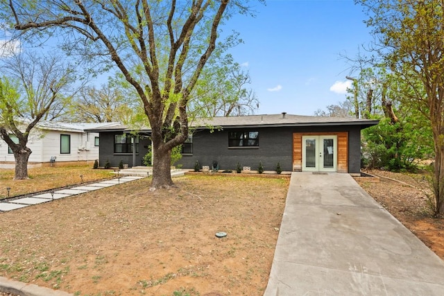 326 W Mulberry St, Fredericksburg, TX 78624 - single story home with driveway and french doors
