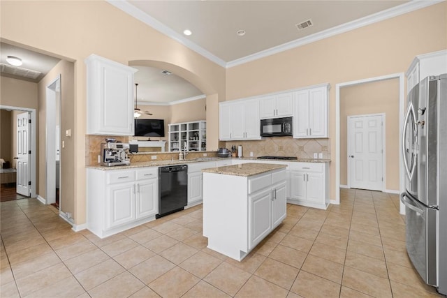 814 Arrowhead Trl, Cedar Park, TX 78613 - kitchen featuring black appliances, light tile patterned flooring, ornamental molding, backsplash, and white cabinets