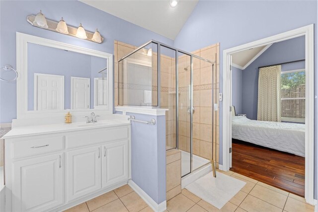 814 Arrowhead Trl, Cedar Park, TX 78613 - ensuite bathroom with lofted ceiling, tile patterned flooring, a shower stall, and vanity