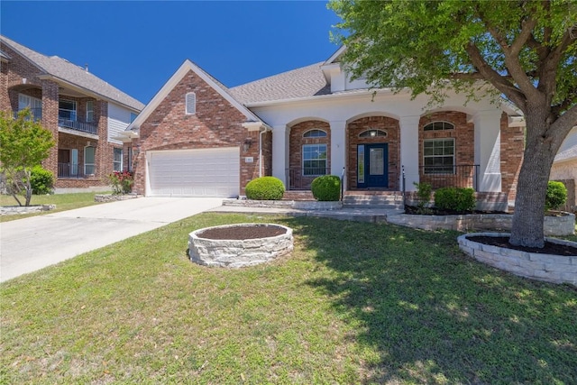 814 Arrowhead Trl, Cedar Park, TX 78613 - view of front facade with a garage, brick siding, driveway, a front yard, and a porch