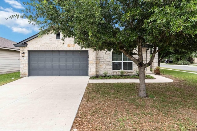 obstructed view of property featuring concrete driveway, an attached garage, stone siding, and a front lawn