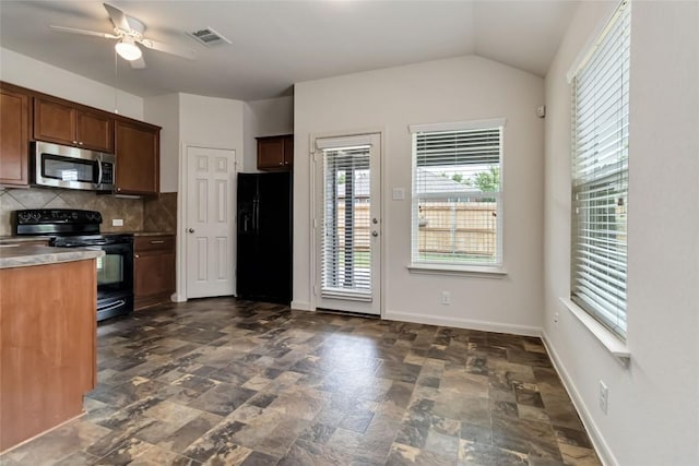 kitchen with a ceiling fan, tasteful backsplash, black appliances, stone finish flooring, and visible vents