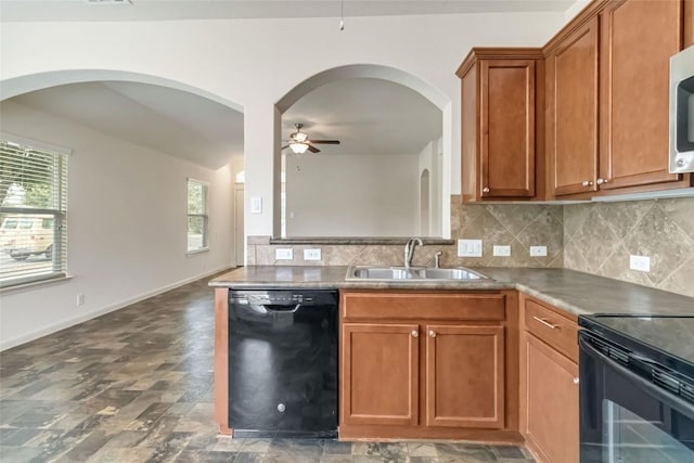 kitchen with ceiling fan, decorative backsplash, a sink, and black appliances