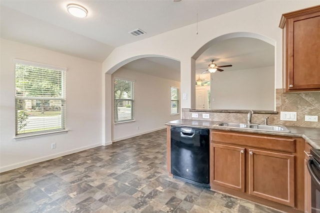 kitchen featuring a ceiling fan, a sink, dishwasher, a healthy amount of sunlight, and visible vents