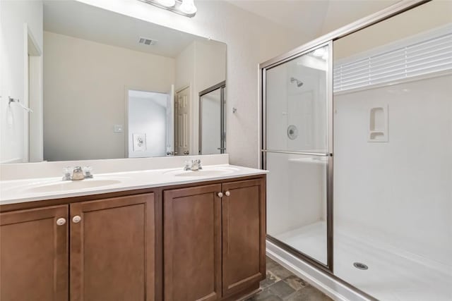 421 Capistrano Dr, San Marcos, TX 78666 - full bathroom featuring a shower stall and double vanity