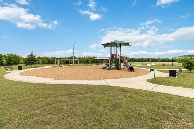 community playground with a lawn and fence