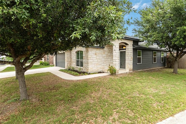 421 Capistrano Dr, San Marcos, TX 78666 - view of front of house featuring concrete driveway, an attached garage, and stone siding