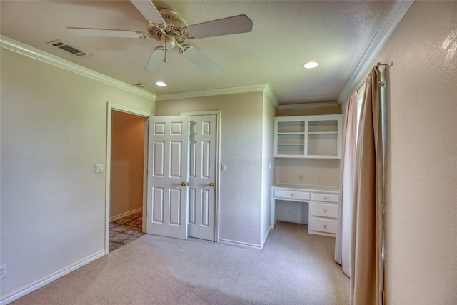 unfurnished bedroom featuring recessed lighting, visible vents, crown molding, baseboards, and light colored carpet
