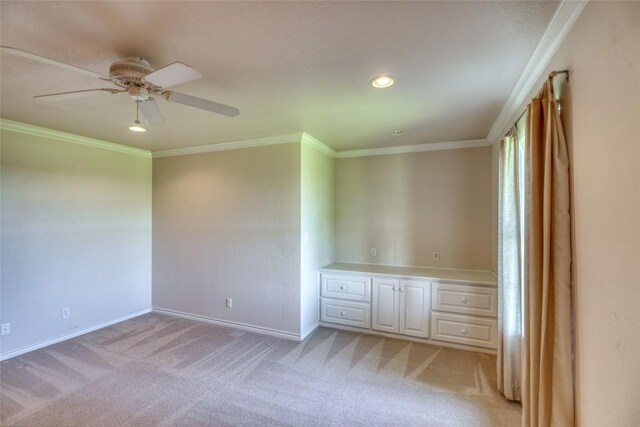 unfurnished room featuring a ceiling fan, light colored carpet, baseboards, ornamental molding, and recessed lighting