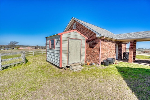 view of shed with fence