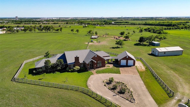 birds eye view of property with a rural view