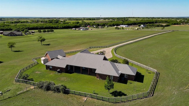 birds eye view of property featuring a rural view