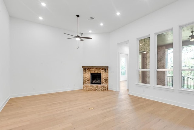 394 Leaning Rock Rdg, Austin, TX 78737 - unfurnished living room featuring ceiling fan, plenty of natural light, light wood-style flooring, baseboards, and recessed lighting
