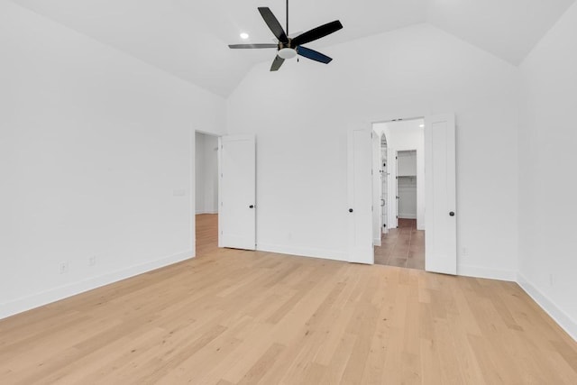 394 Leaning Rock Rdg, Austin, TX 78737 - unfurnished bedroom with high vaulted ceiling, light wood-type flooring, baseboards, a walk in closet, and ceiling fan