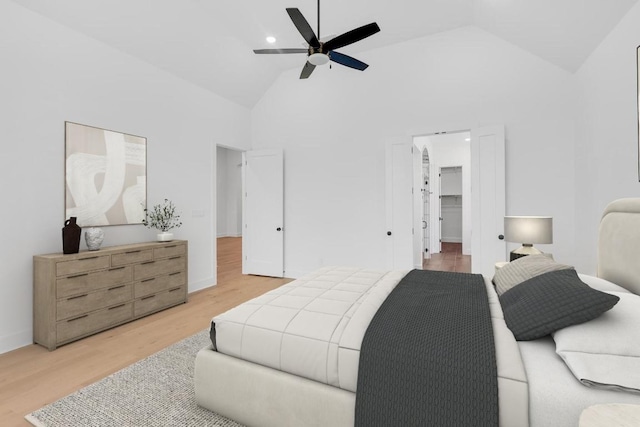 394 Leaning Rock Rdg, Austin, TX 78737 - bedroom featuring light wood-type flooring, high vaulted ceiling, a spacious closet, and a ceiling fan