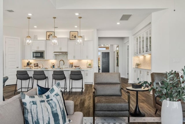 237 San Xavier St, Georgetown, TX 78633 - living room with dark wood finished floors and recessed lighting