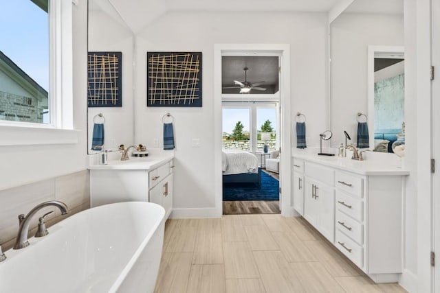 237 San Xavier St, Georgetown, TX 78633 - full bath featuring ensuite bath, a freestanding bath, vanity, and a ceiling fan