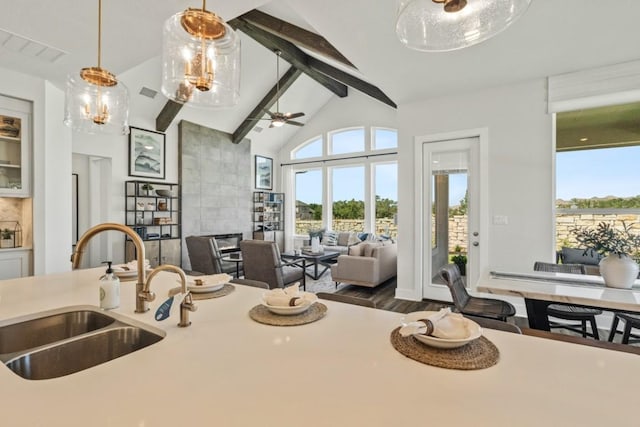 237 San Xavier St, Georgetown, TX 78633 - kitchen with a sink, healthy amount of natural light, open floor plan, and pendant lighting