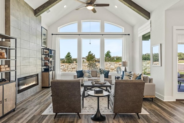 237 San Xavier St, Georgetown, TX 78633 - living room featuring a tile fireplace, dark wood finished floors, beam ceiling, a ceiling fan, and high vaulted ceiling