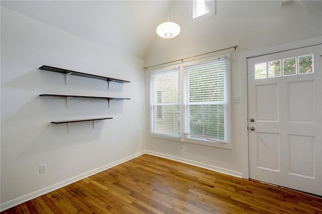 1110 W 22nd St Unit 13, Austin, TX 78705 - foyer entrance featuring hardwood / wood-style flooring, healthy amount of natural light, baseboards, and vaulted ceiling