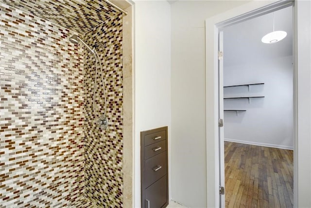 interior space with baseboards and wood-type flooring