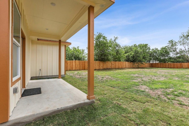 view of yard with a patio area and a fenced backyard
