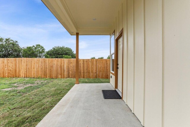 view of yard featuring a patio area and fence