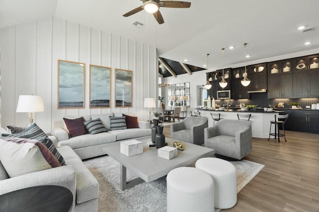2104 Tobiano Trce, Georgetown, TX 78633 - living area featuring ceiling fan, lofted ceiling, light wood-style flooring, and recessed lighting