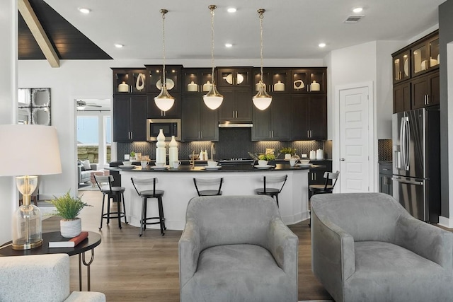 2104 Tobiano Trce, Georgetown, TX 78633 - living room with wood finished floors, recessed lighting, and beamed ceiling