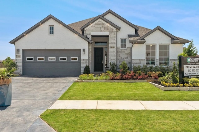 2104 Tobiano Trce, Georgetown, TX 78633 - french country style house with stone siding, concrete driveway, a front yard, an attached garage, and a shingled roof
