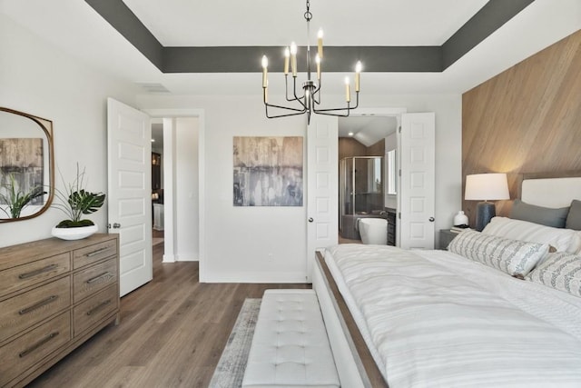2104 Tobiano Trce, Georgetown, TX 78633 - bedroom featuring a chandelier and dark wood-style flooring