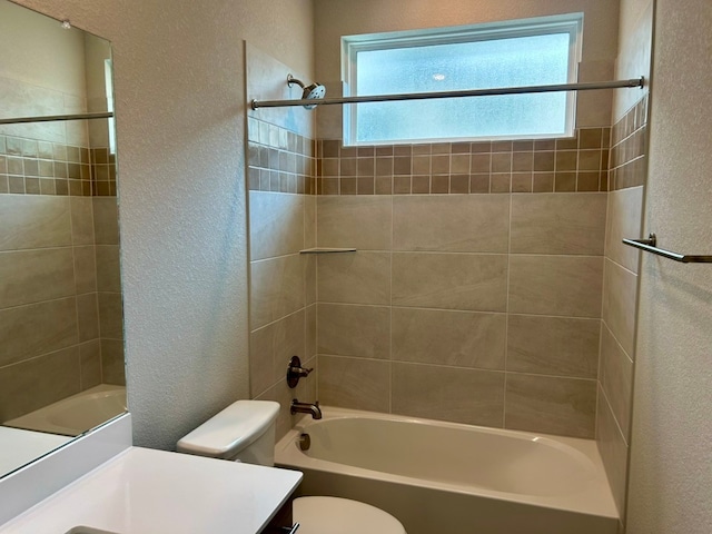 2104 Tobiano Trce, Georgetown, TX 78633 - full bath with a textured wall, vanity, plenty of natural light, and bathing tub / shower combination