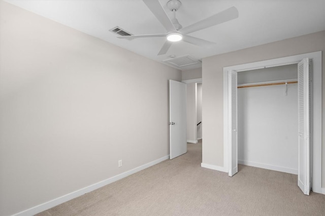 3400 Santa Fe Dr, Austin, TX 78741 - unfurnished bedroom with light colored carpet, attic access, a closet, and a ceiling fan