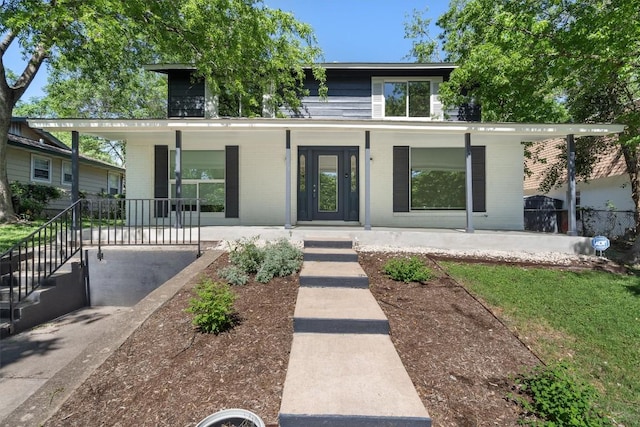 3400 Santa Fe Dr, Austin, TX 78741 - view of front of home featuring covered porch and brick siding