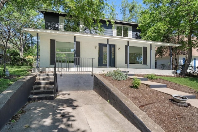 3400 Santa Fe Dr, Austin, TX 78741 - view of front of property featuring covered porch and brick siding