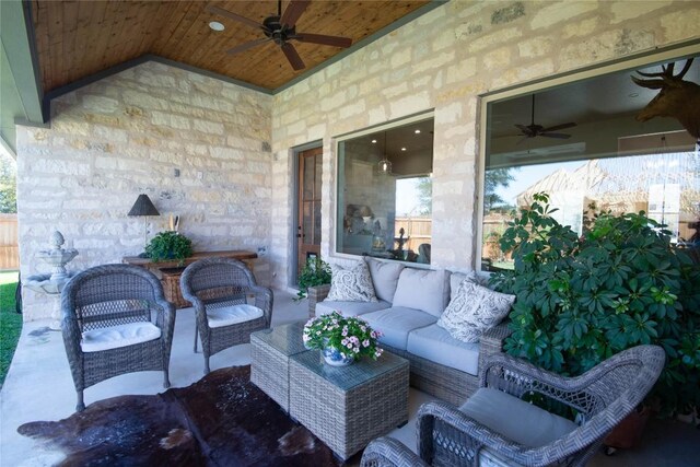 view of patio / terrace with an outdoor living space and a ceiling fan