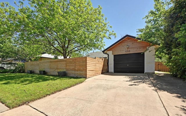 1213 S Trace Dr, Austin, TX 78745 - view of front of property featuring brick siding, concrete driveway, a detached garage, and an outbuilding
