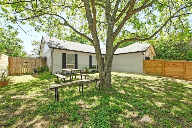 1213 S Trace Dr, Austin, TX 78745 - back of property with brick siding and a gate