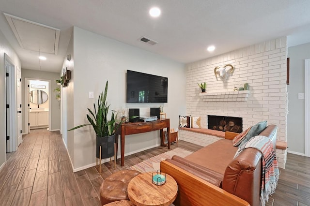 1213 S Trace Dr, Austin, TX 78745 - living area with attic access, wood finished floors, a fireplace, and recessed lighting