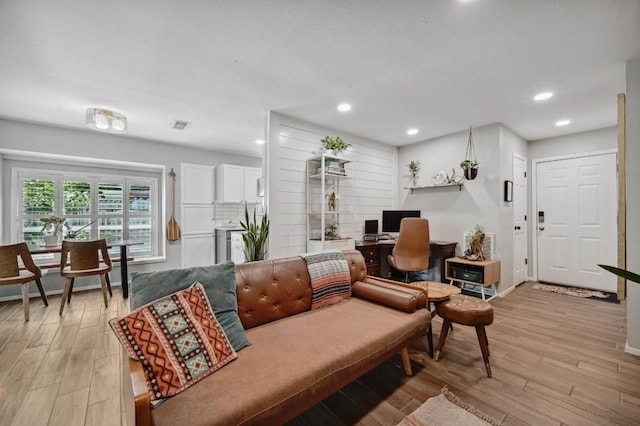 1213 S Trace Dr, Austin, TX 78745 - living room with a desk, light wood finished floors, and recessed lighting