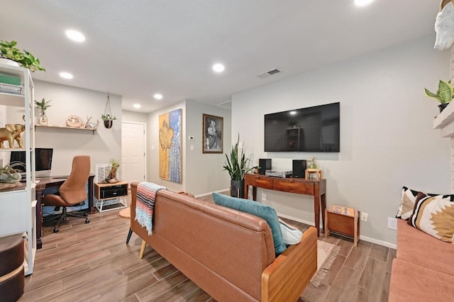 1213 S Trace Dr, Austin, TX 78745 - living room with baseboards, visible vents, recessed lighting, and light wood-style floors