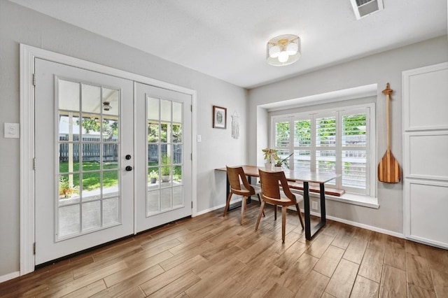 1213 S Trace Dr, Austin, TX 78745 - entryway with french doors and wood finished floors